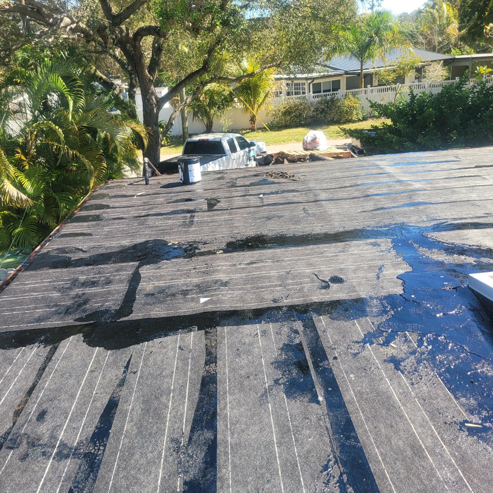 Dark storm sky over a South Florida home protected by a Shield Proof roof